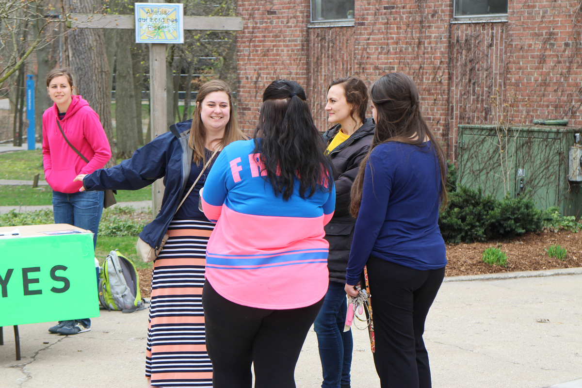 Pictured: Dialogue story - Rachel and Chloe talking to students at Aquinas College.