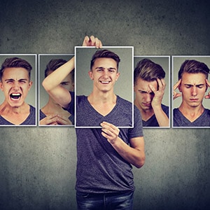 Image: Man choosing from multiple face options.