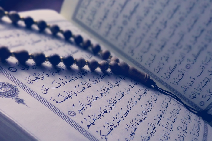 Quran with prayer beads