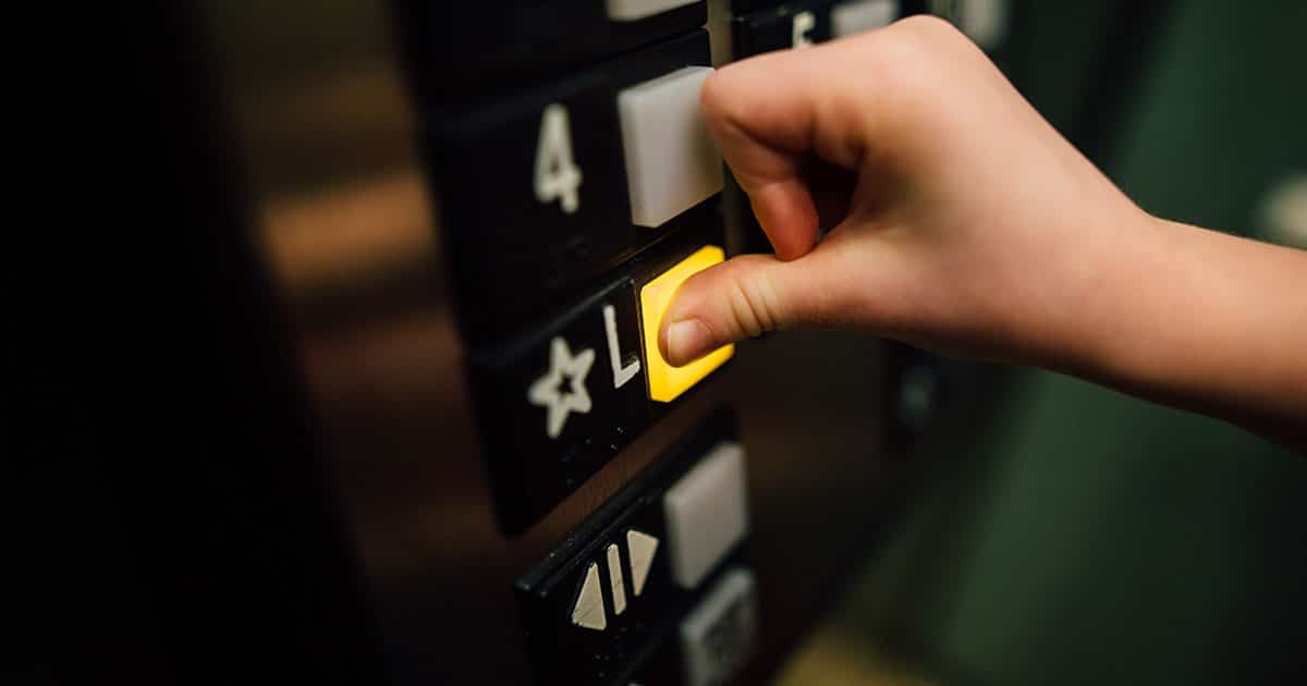 Elevator button being pushed