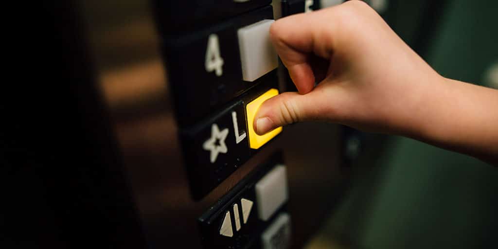 Elevator button being pushed