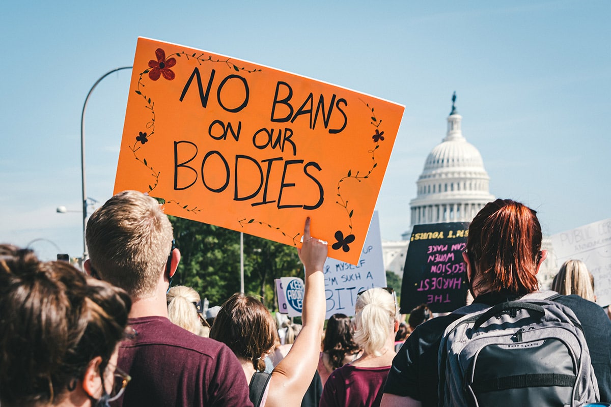 A pro-choice sign that says "NO BANS ON OUR BODIES" at a protest in front of the U.S. Capitol